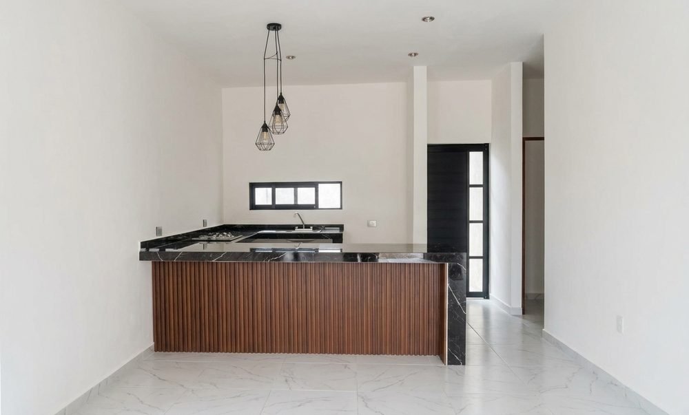 Cocina con barra desayunadora de la Casa Dalia